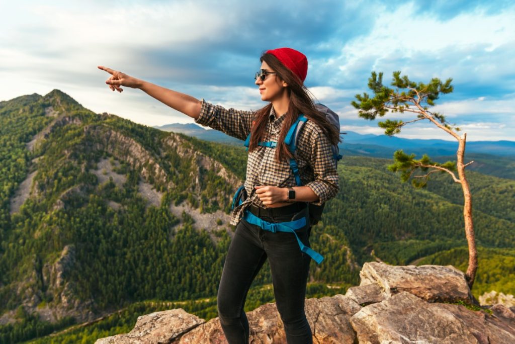 a young tourist pointing her finger at the mountai 2022 01 19 00 15 47 utc
